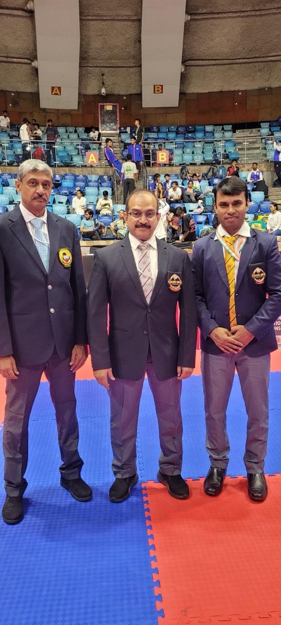 Coach medal pose