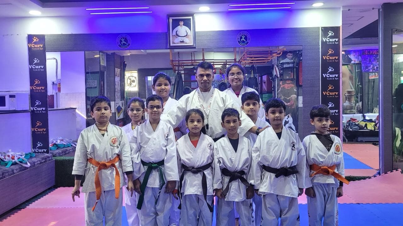 Karate students training at the academy