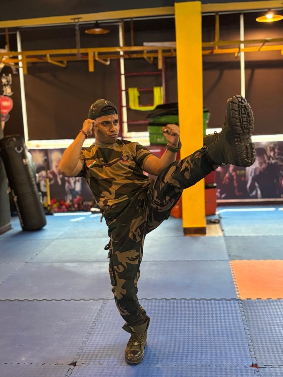 High kick demonstration during military martial arts training