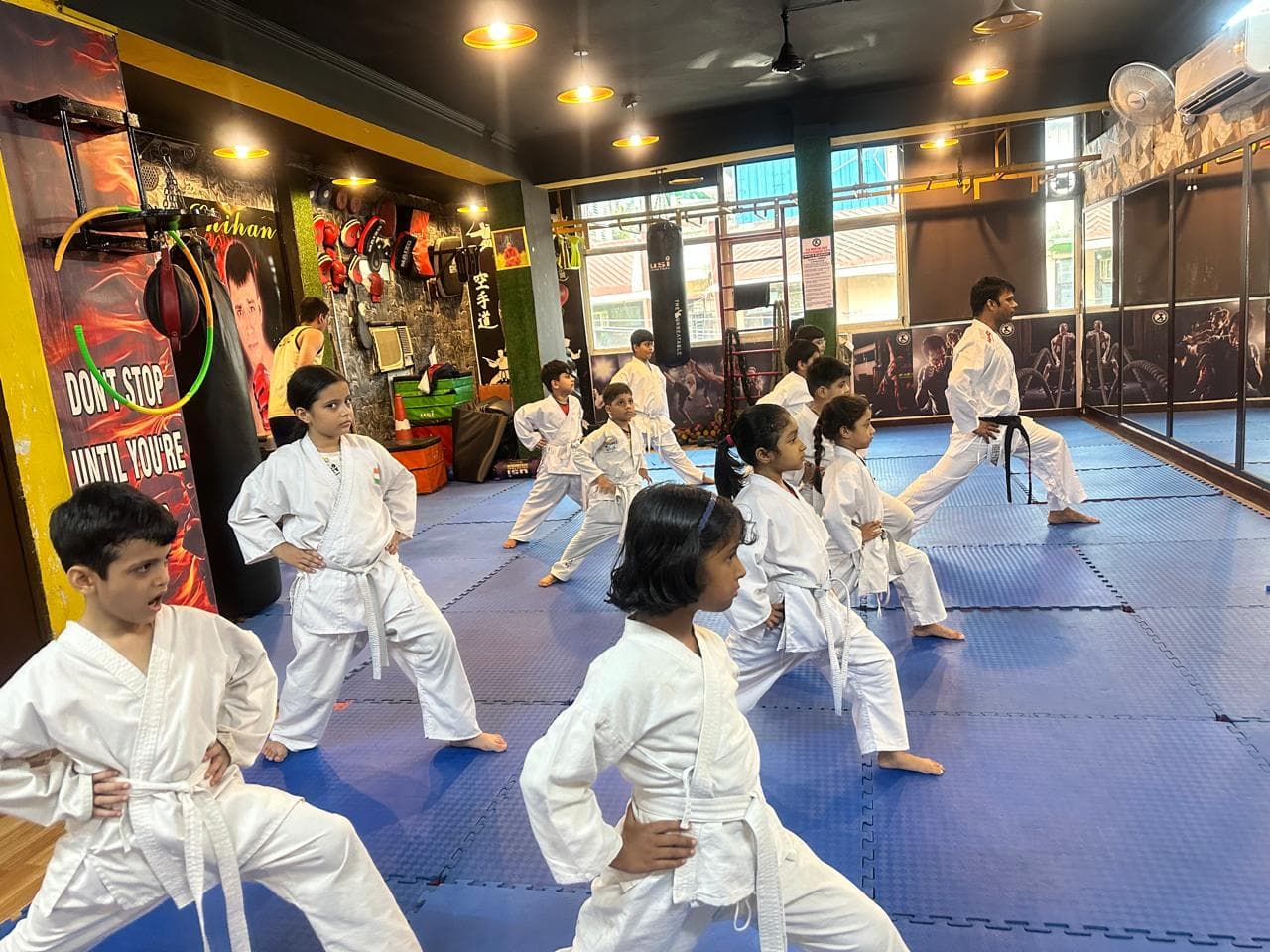 Children practicing martial arts techniques during class