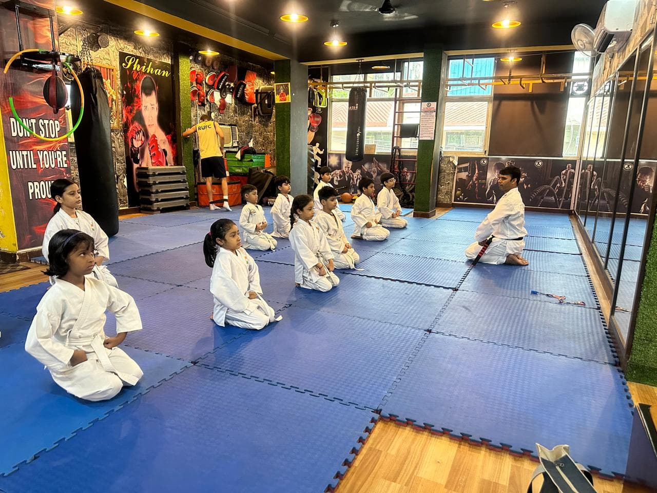 Students seated during a martial arts training session