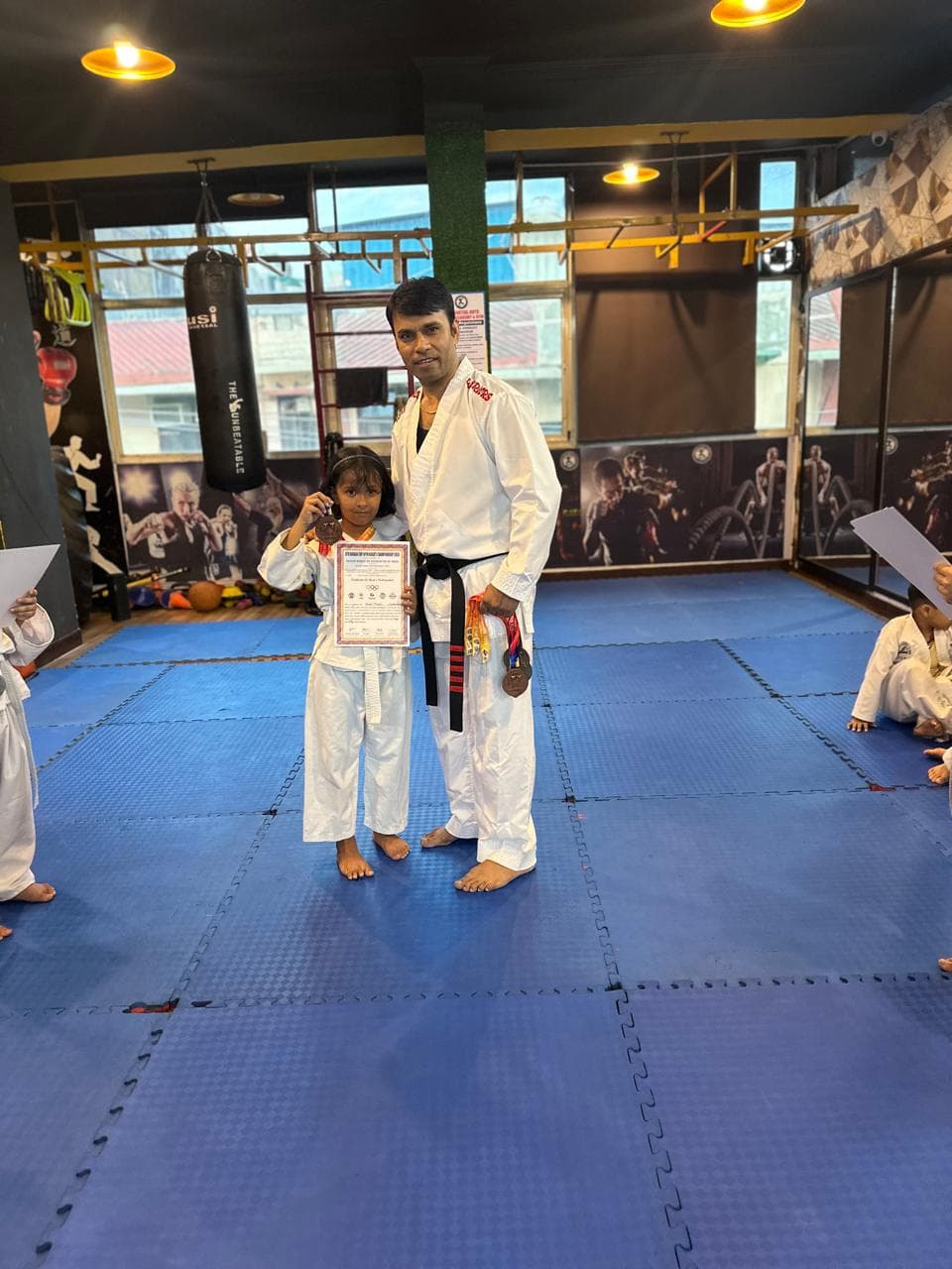 Instructor posing with a martial arts student
