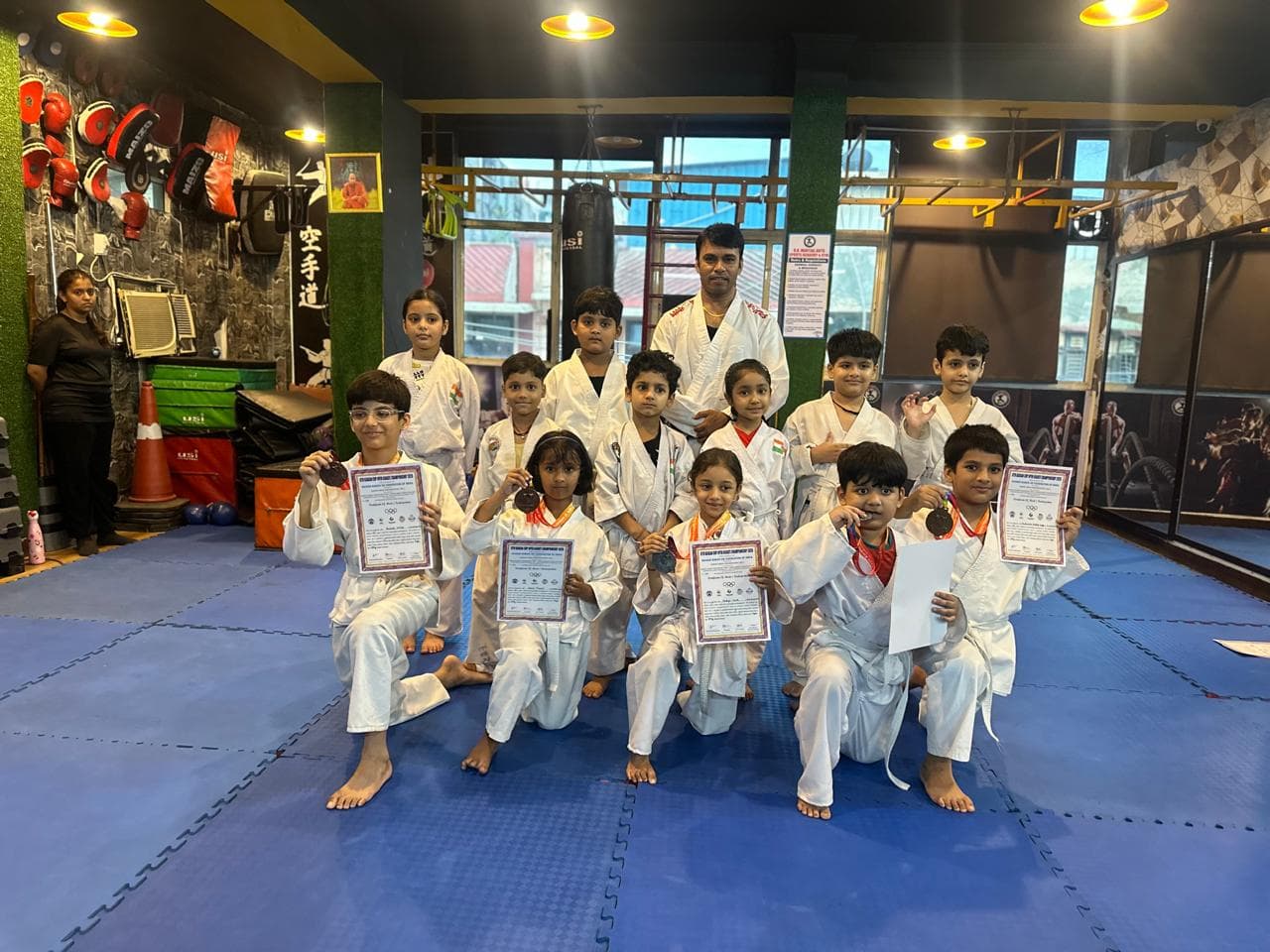 Children posing together after a martial arts session