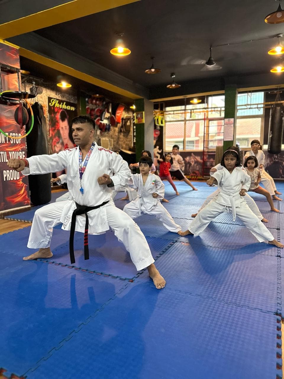Students demonstrating martial arts stances