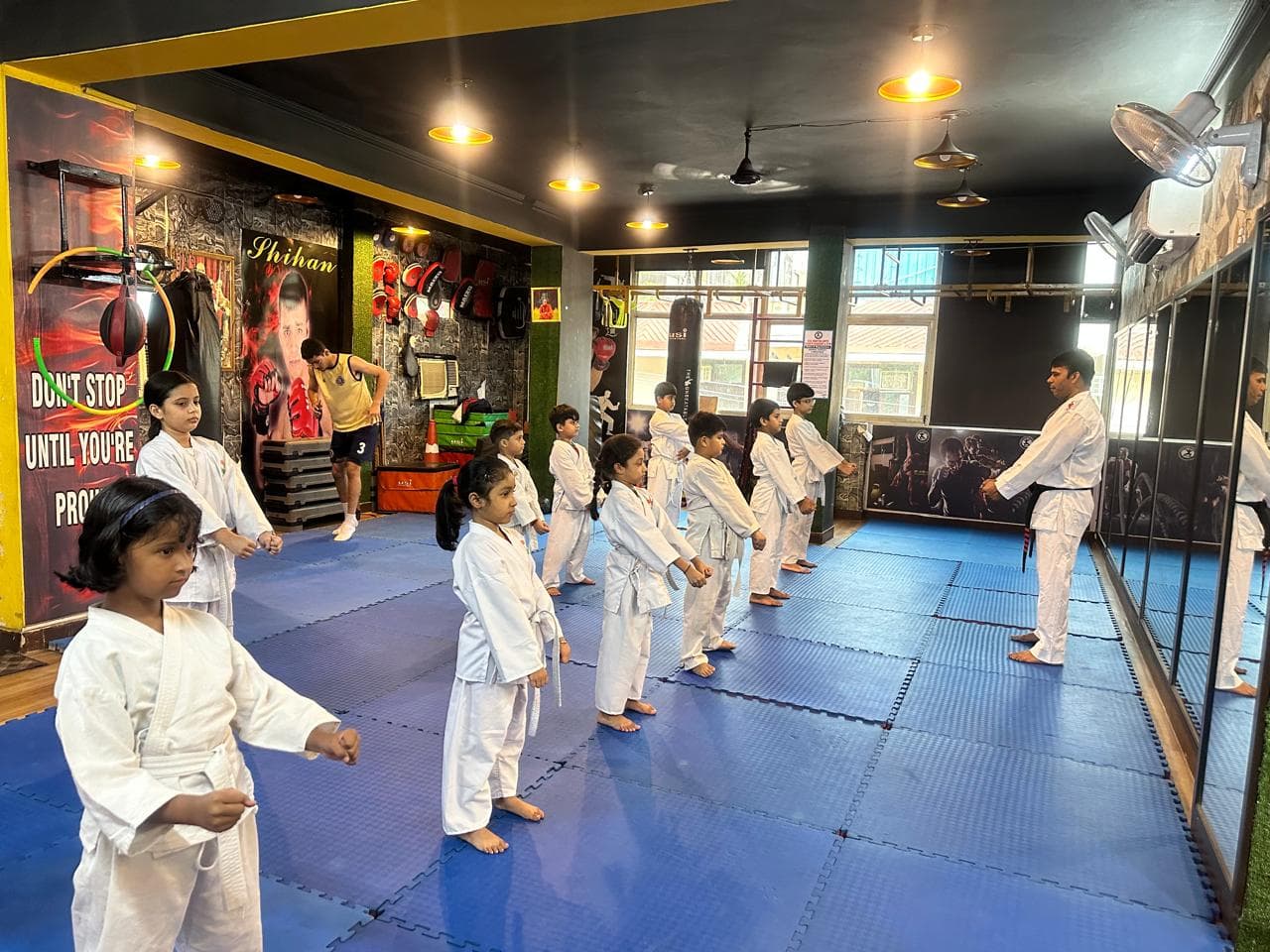 Young students training together in martial arts class