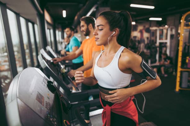 young-woman-exercising-on-treadmill