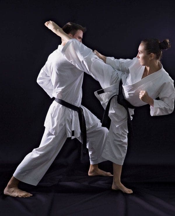 Two MMA fighters engaged 